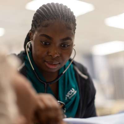 a v.c.u. nursing student performs skills in the clinical learning center