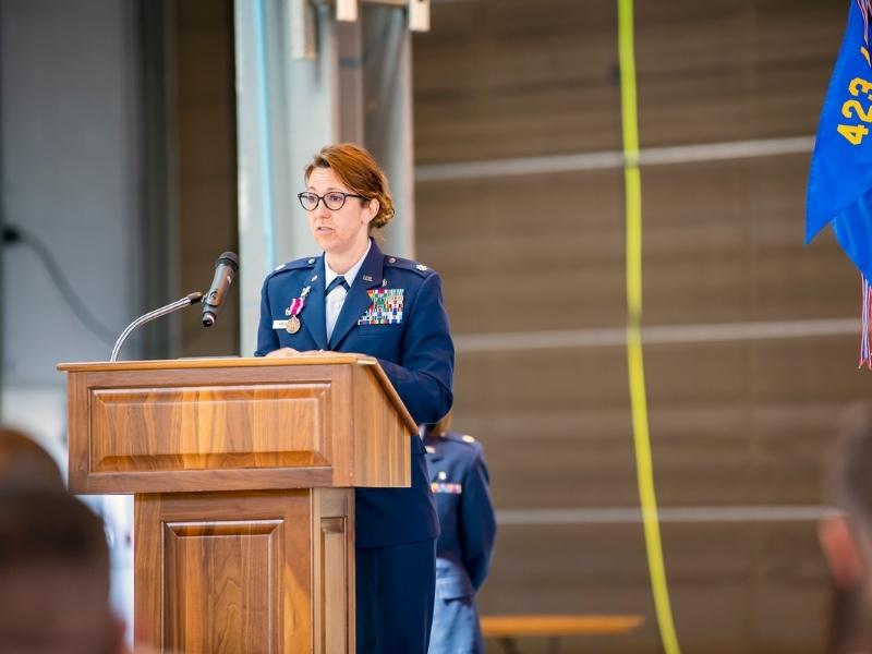 u.s. air force lieutenant colonel elizabeth hoettels speaks at a podium
