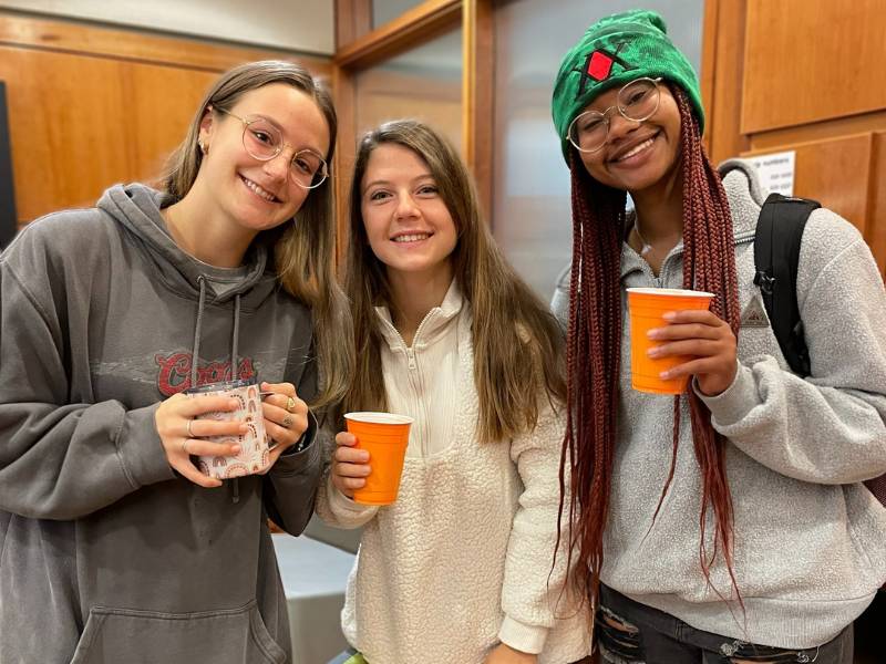 three v.c.u. nursing students enjoy free coffee during a student social event