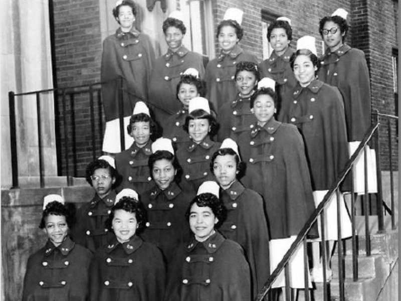 st. phillips nursing students in capes pose on the school's steps