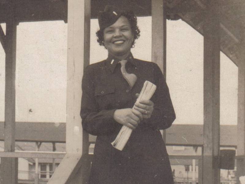 an old photograph depicts louise lomax winters in her military uniform smiling