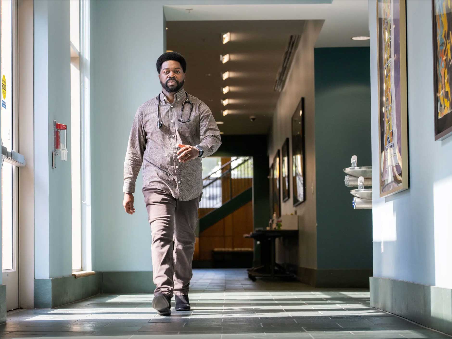 A student walking down a hallway