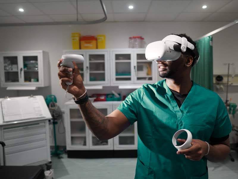 a nurse in a clinic wearing a virtual reality headset and holding up a v.r. controller