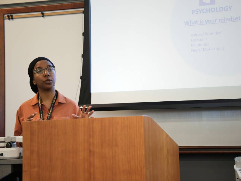 ana diallo, ph.d., makes a presentation at a podium