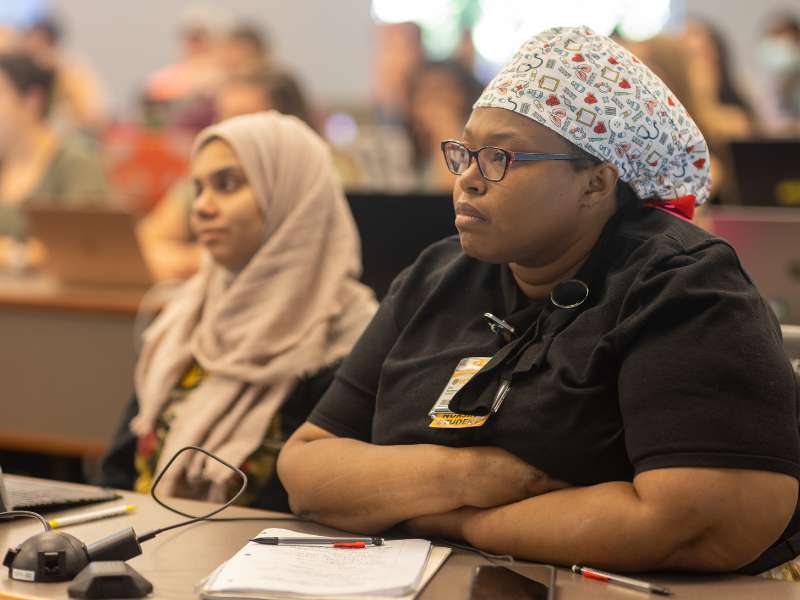 students listen in a lecture hall