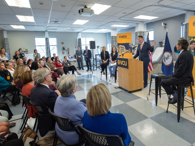 virginia governor glenn youngkin addresses an audience in the school's clinical learning center
