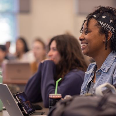 A nursing student smiles in class