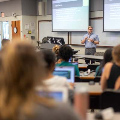 a nursing faculty member lectures a class