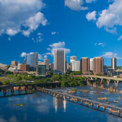 the downtown richmond virginia skyline next to the james river