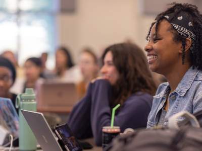 a nursing student smiles in class