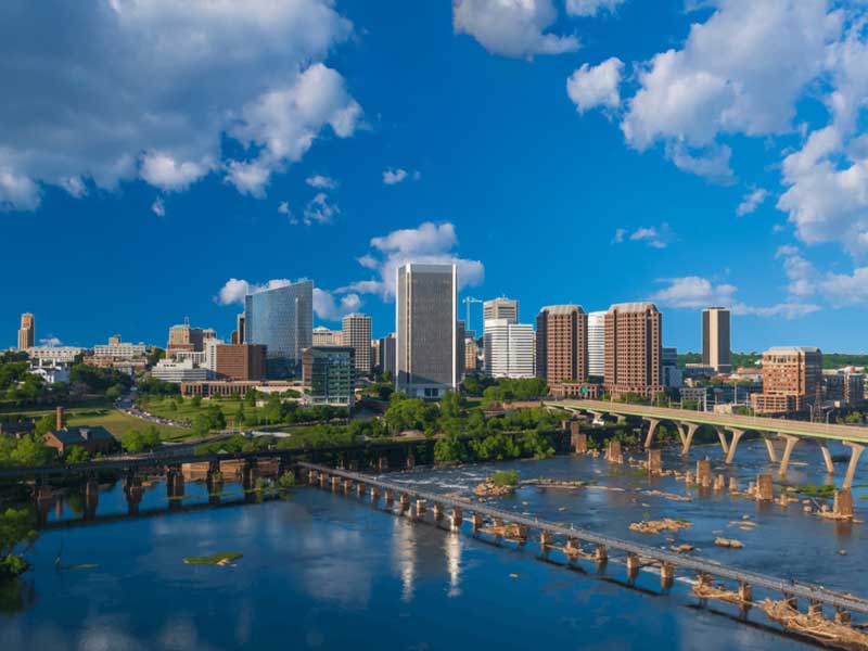 the downtown richmond virginia skyline next to the james river